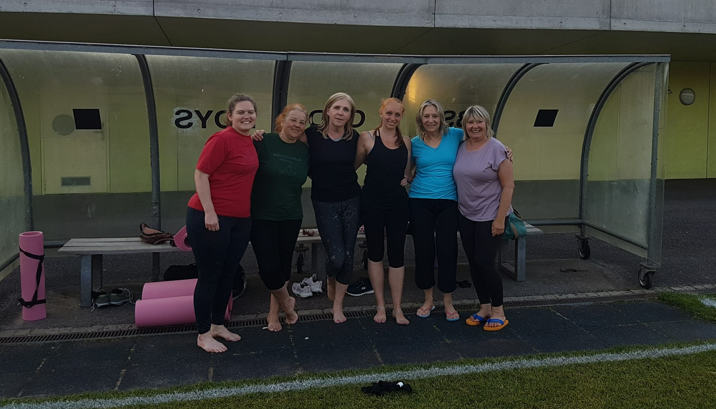 A group of women posing for a photo

Description automatically generated